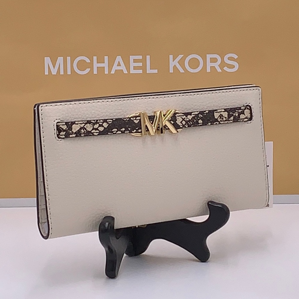 Michael Kors Reed Large
Snap Bifold Wallet Nat / Light Cream Color